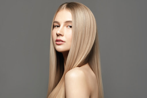 Image of a woman with long, blonde, straight hair Image of a woman with long, blonde, straight hair